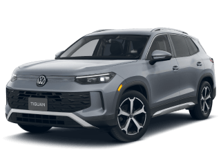 Silver Volkswagen Tiguan SUV on a dark green background.