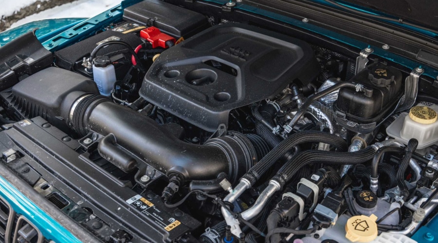 Close-up of a modern Jeep 2.0-liter turbocharged four-cylinder engine bay.