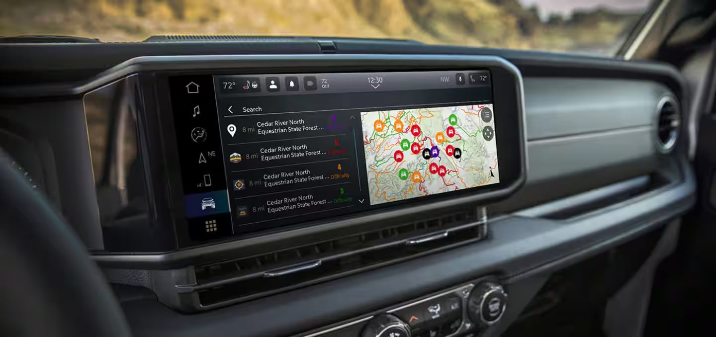 Close-up of a Jeep dashboard showing the large touchscreen display with an active navigation map.