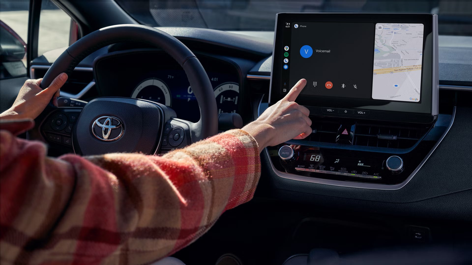 Driver using a Toyota multimedia touchscreen display