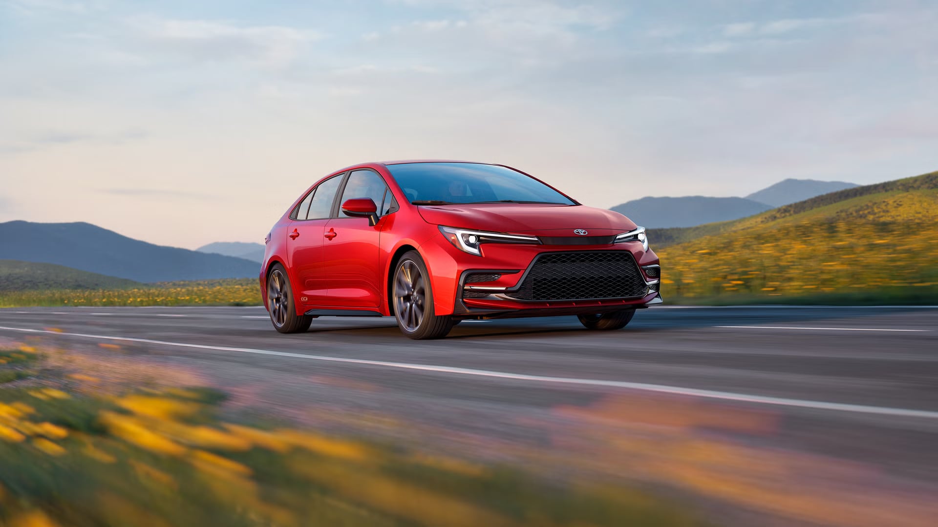 Toyota Corolla driving outdoors